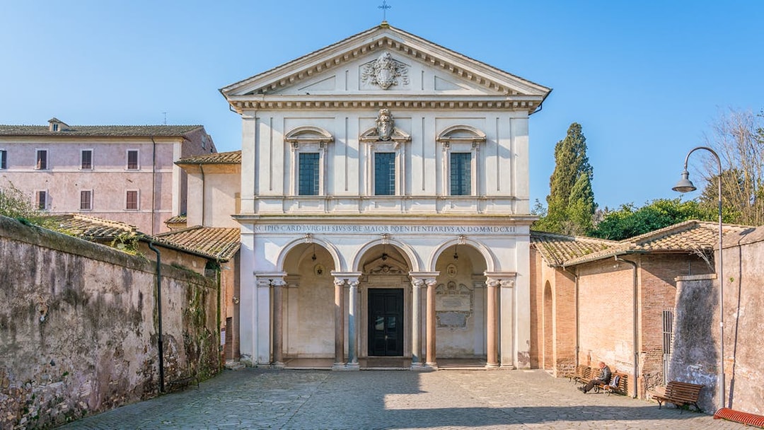 Basilica of San Sebastian facade in Rome with arched entrance and historical architecture.