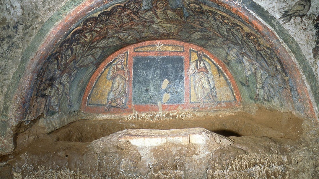 Wall paintings depicting biblical figures in the Catacombs of Domitilla, Rome.