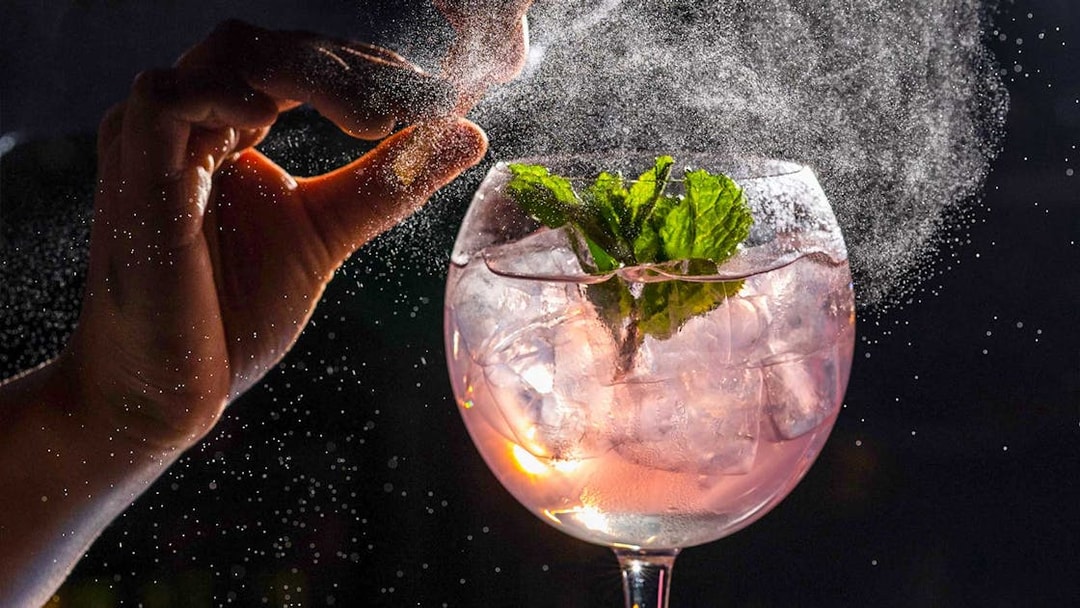 Cocktail preparation at CÉ LA VI Dubai with mint garnish and ice.