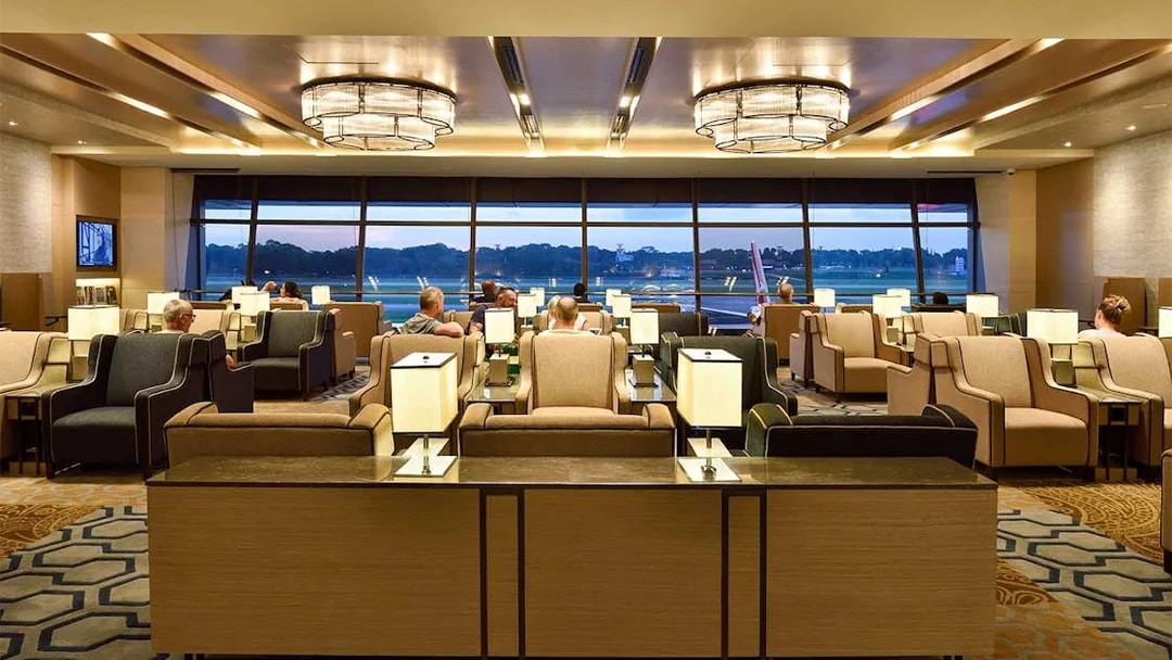 Plaza Premium Lounge seating area with travelers at T1 International Departures.