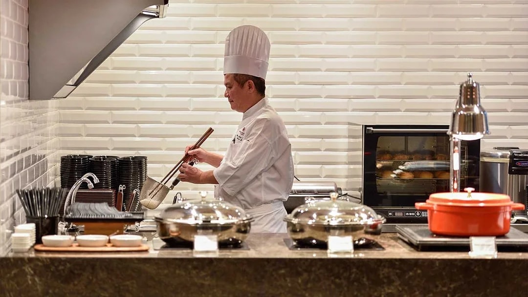 Chef preparing food at Plaza Premium Lounge, T1, International Departures.