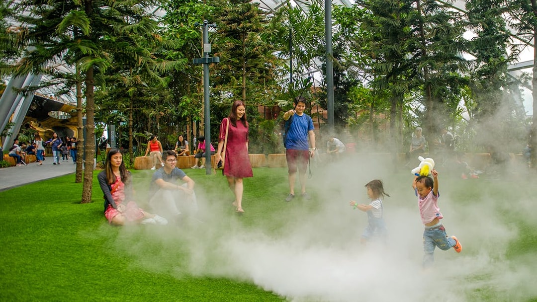 Children playing in mist at Foggy Bowls, Canopy Park, Jewel Changi.