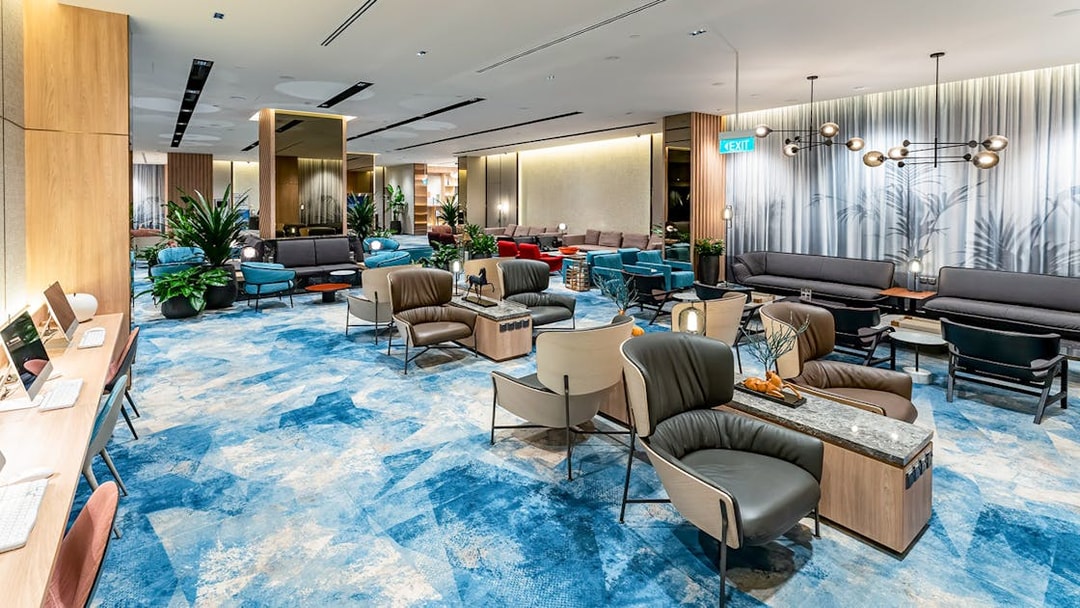 Changi Lounge interior with seating areas and modern decor, Singapore.