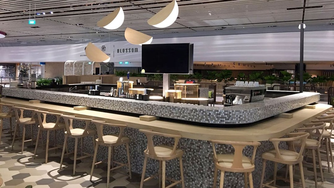 Blossom lounge seating area at SATS T4 International Departures.