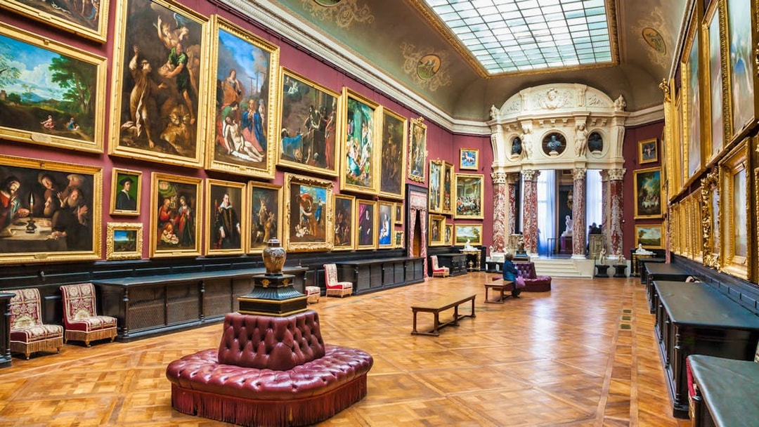 Chateau of Chantilly painting gallery with ornate artworks and elegant interior.