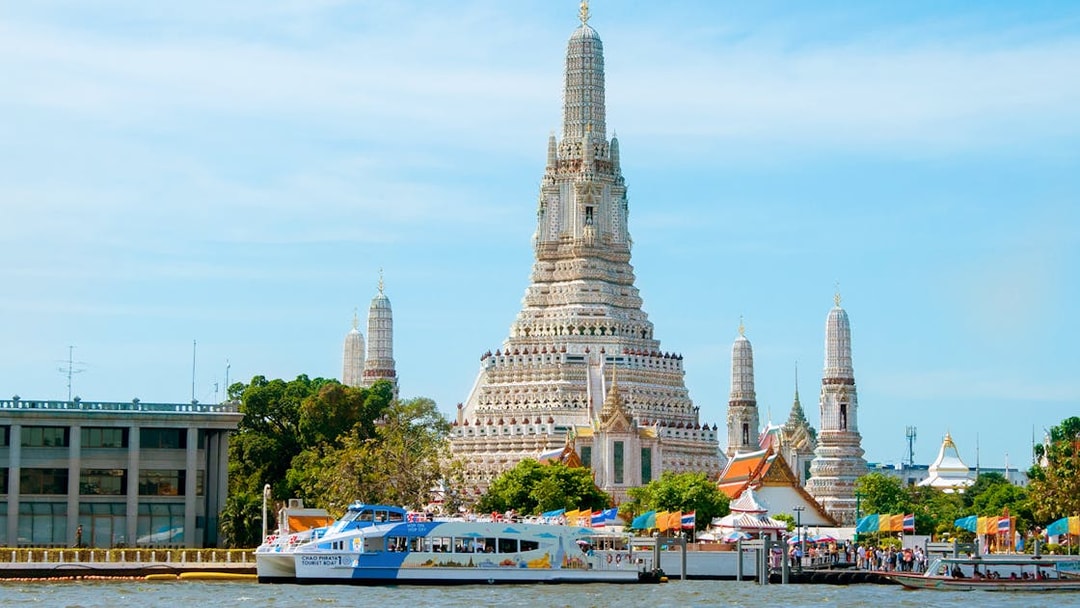 Chao Phraya Tourist Boat near Wat Arun temple in Bangkok, Thailand.