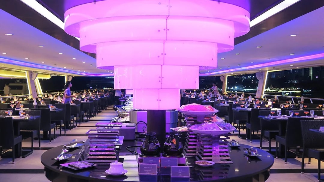 Chao Phraya Princess Cruise dining area with buffet setup and ambient lighting.