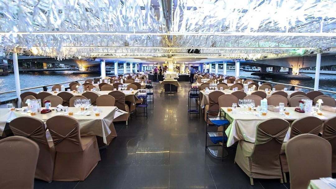 Dinner tables set on Chao Phraya Princess Cruise, Bangkok.
