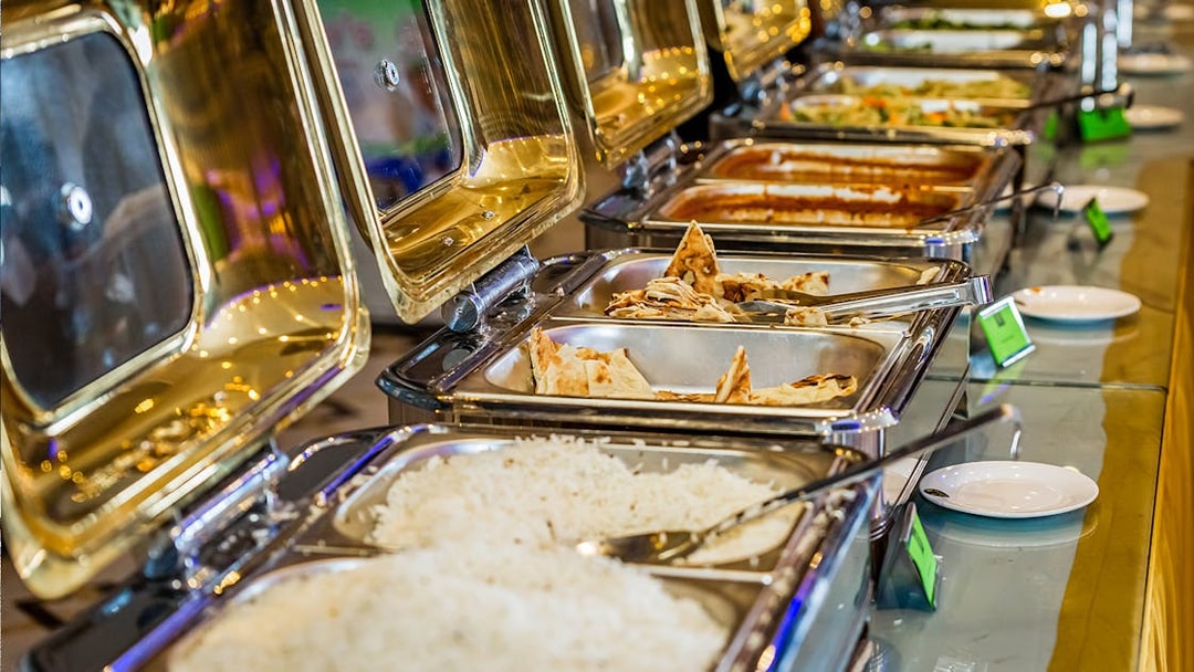Buffet with Indian dishes on Chao Phraya Princess Cruise, featuring rice and naan.