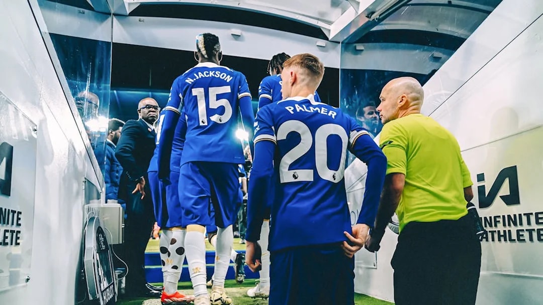 Chelsea FC players entering the stadium tunnel during a tour.