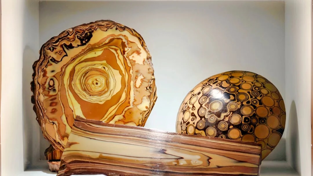 Artifacts displayed at Choco-Story Paris, featuring circular and layered designs.