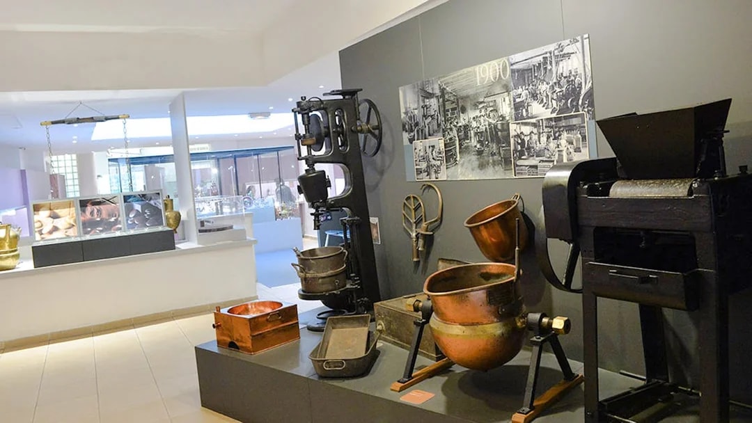 Artifacts and machinery display at Choco-Story Paris museum.
