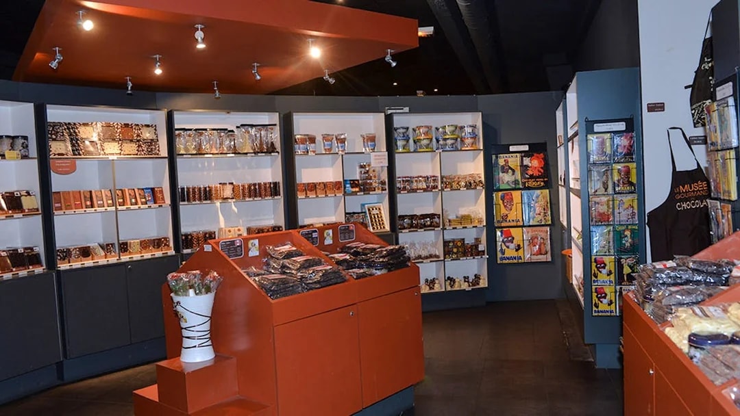 Choco-Story Paris interior with chocolate displays and merchandise shelves.