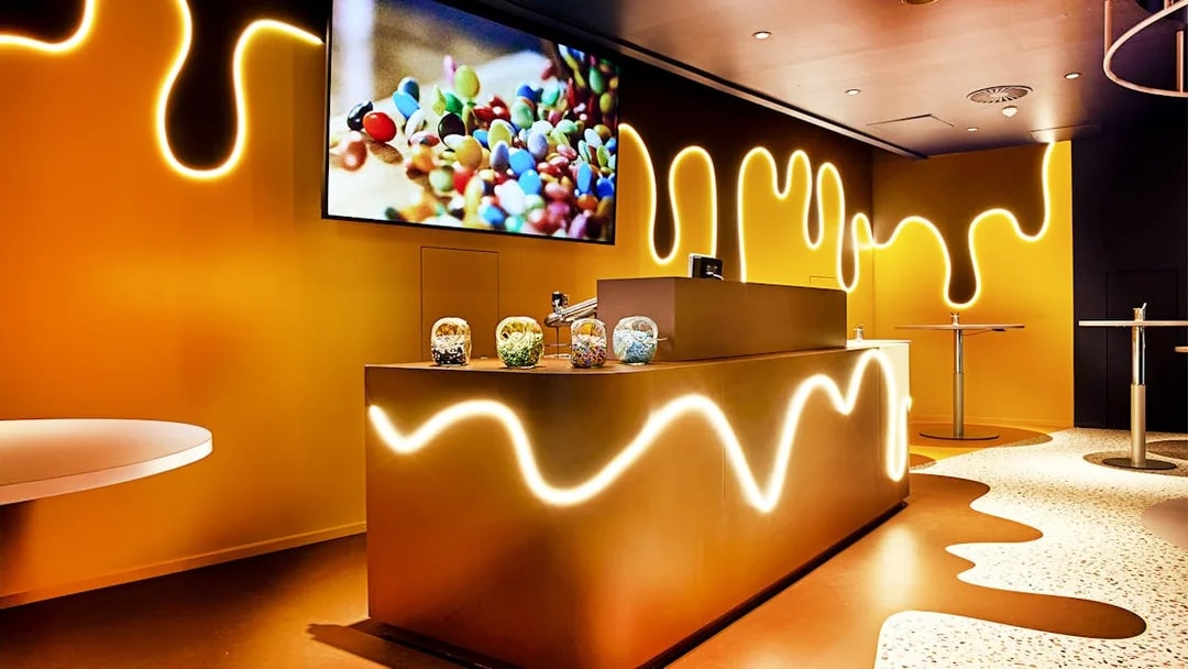 Chocoversum interior with chocolate-themed decor and candy jars, Hamburg.