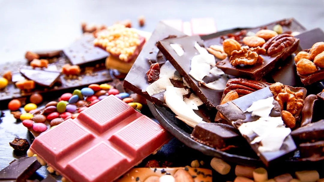 Assorted chocolates with nuts and toppings at Chocoversum, Hamburg.