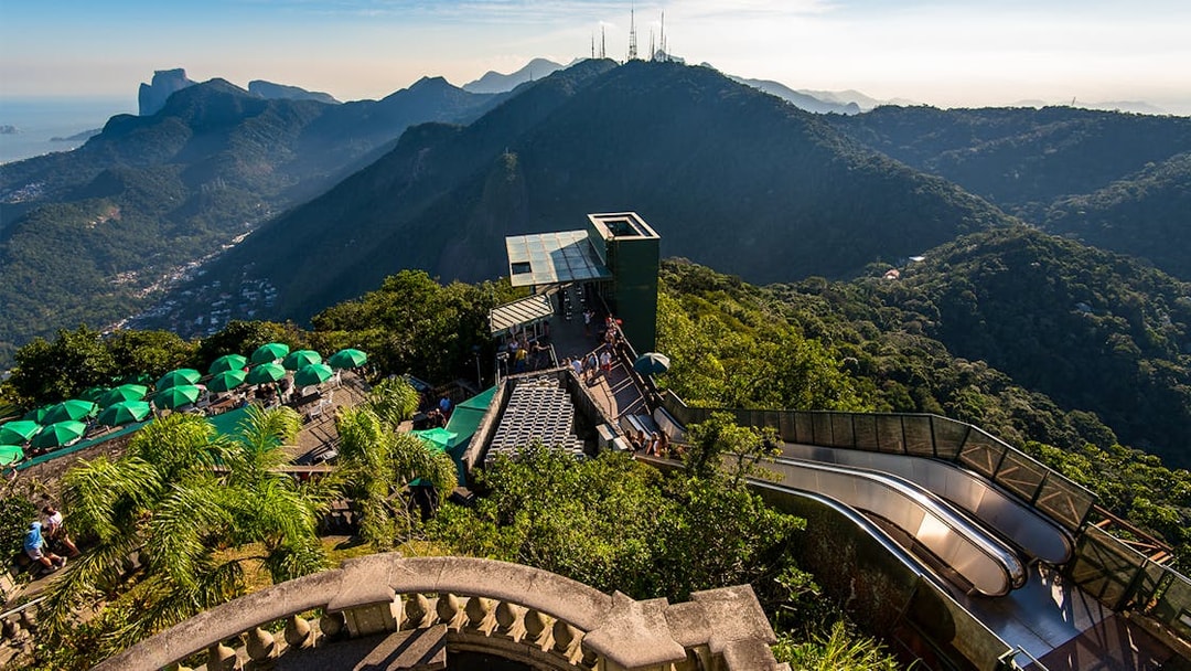 Tijuca Forest mountains view from Corcovado Mountain, green umbrellas, staircase to Christ the Redeemer.