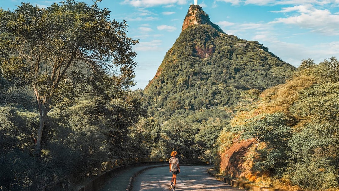 Hiker on trail towards Christ the Redeemer statue in Rio de Janeiro, Brazil.