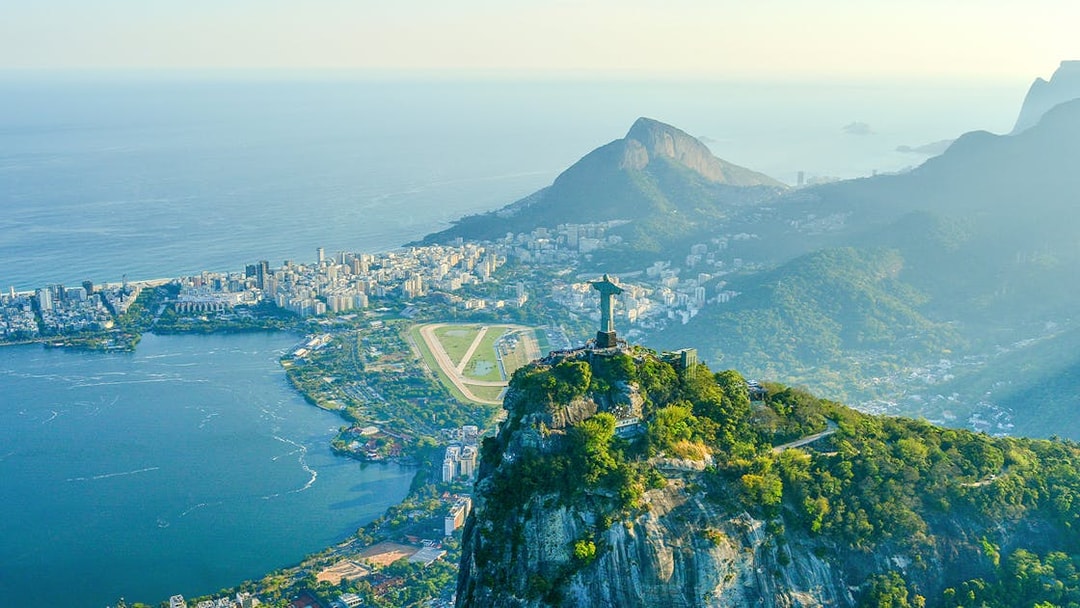 Aerial view of Rio de Janeiro with Christ the Redeemer, Corcovado Mountain, Sugarloaf Mountain, and Guanabara Bay.