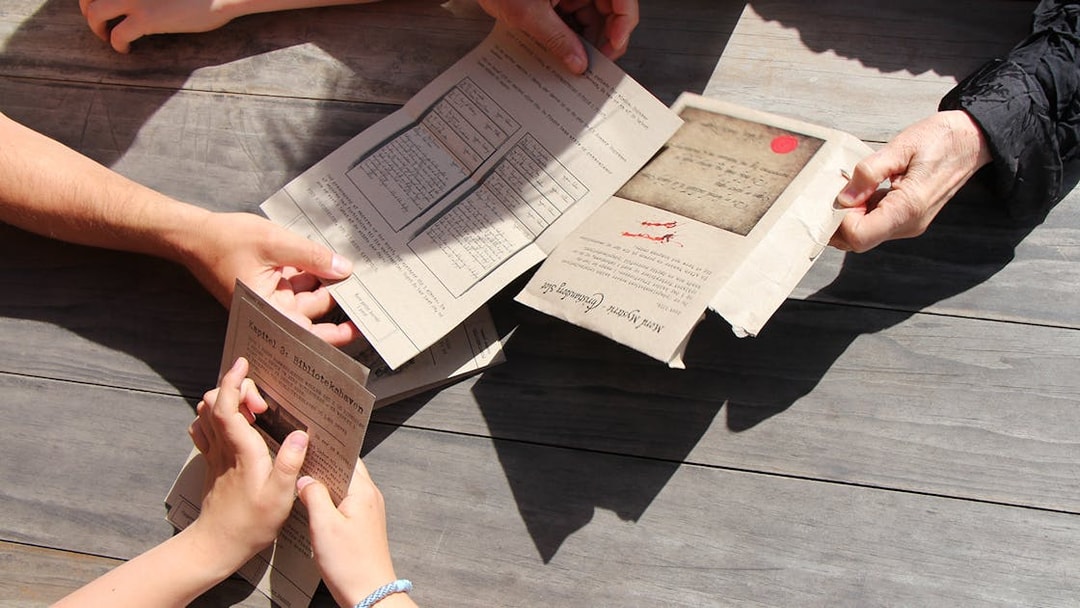 Participants examining clues during a murder mystery at Christiansborg Palace.