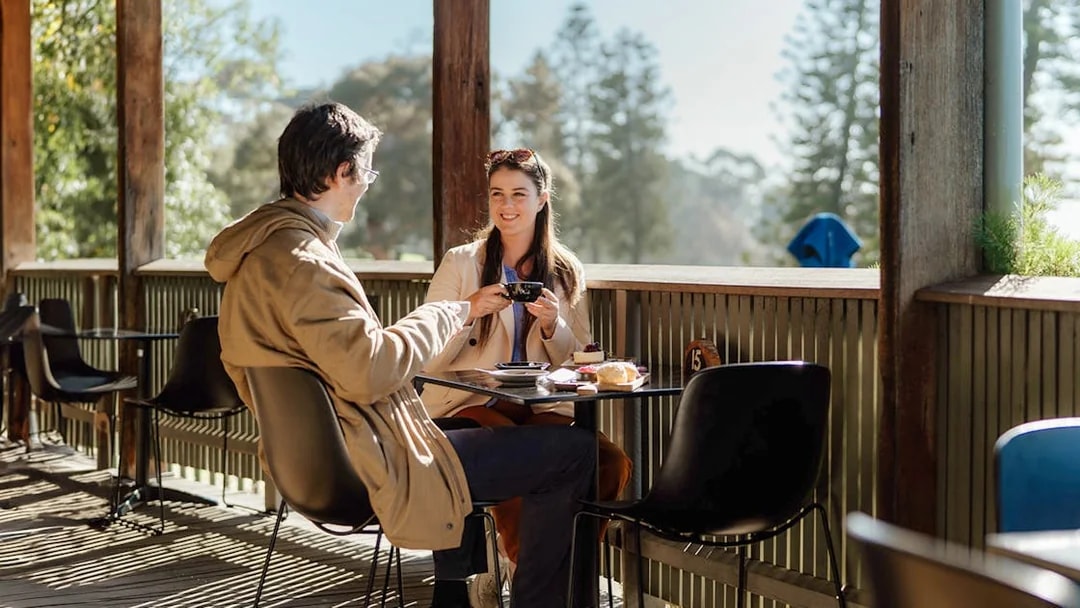 Couple enjoying coffee at a cafe on Churchill Island.