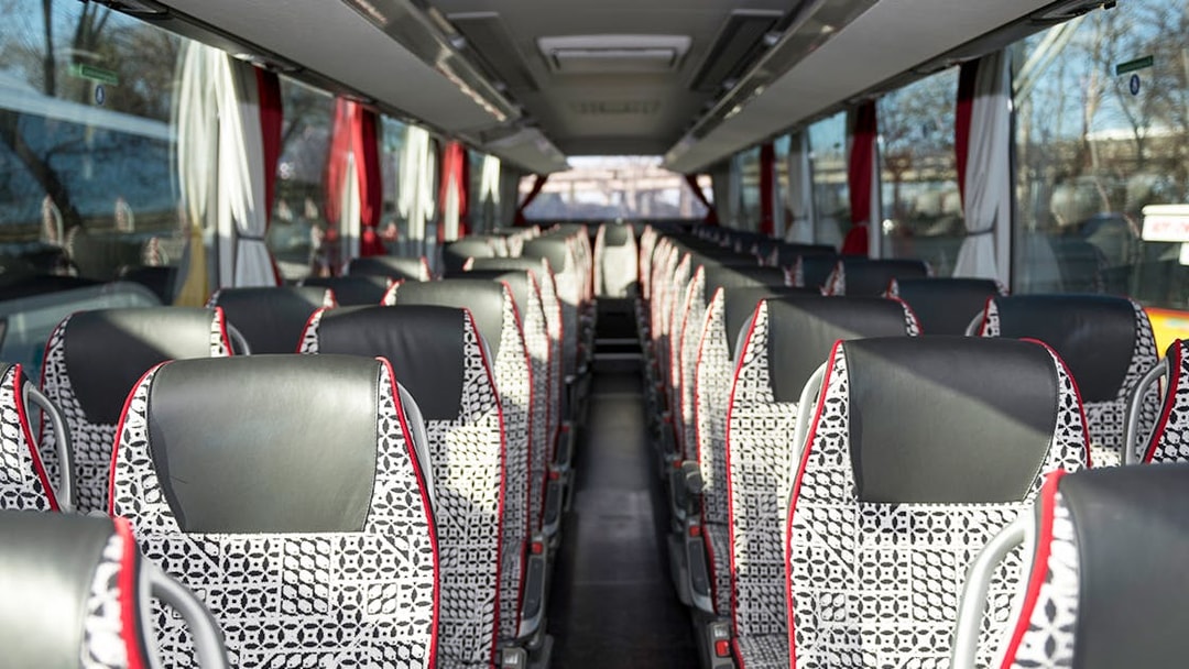 Interior of SIT shuttle bus from Ciampino Airport to Roma Termini, showing patterned seats.