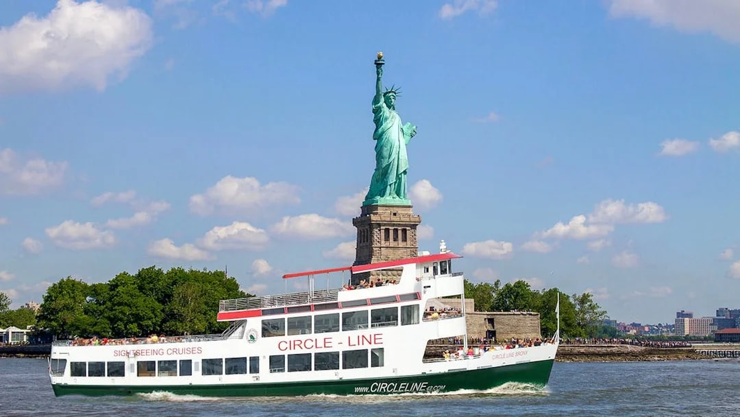 Circle Line cruise passing the Statue of Liberty in New York City.