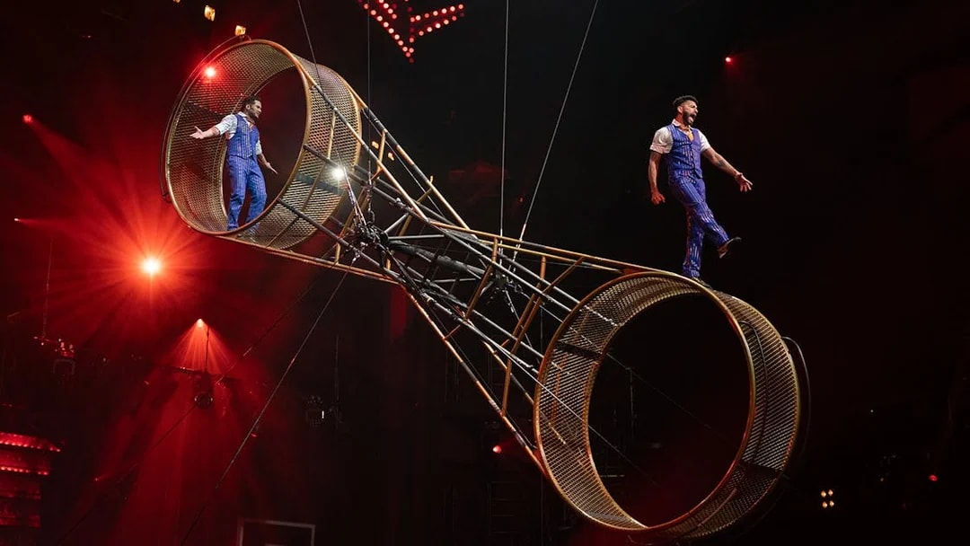 Performers on a rotating wheel at Mad Apple show, Las Vegas.
