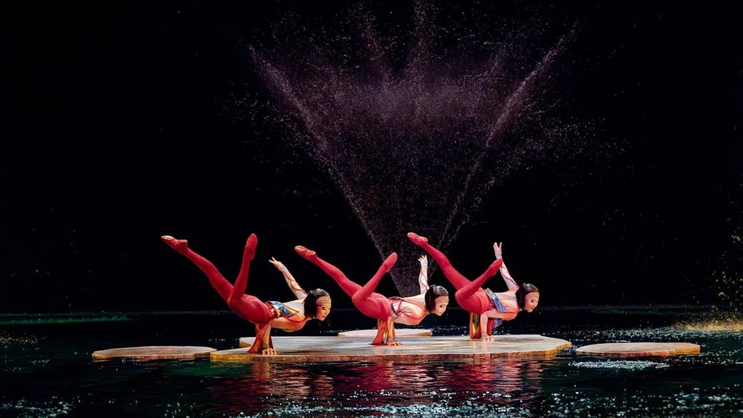 Acrobats performing on water stage in Cirque du Soleil's "O" show, Las Vegas.