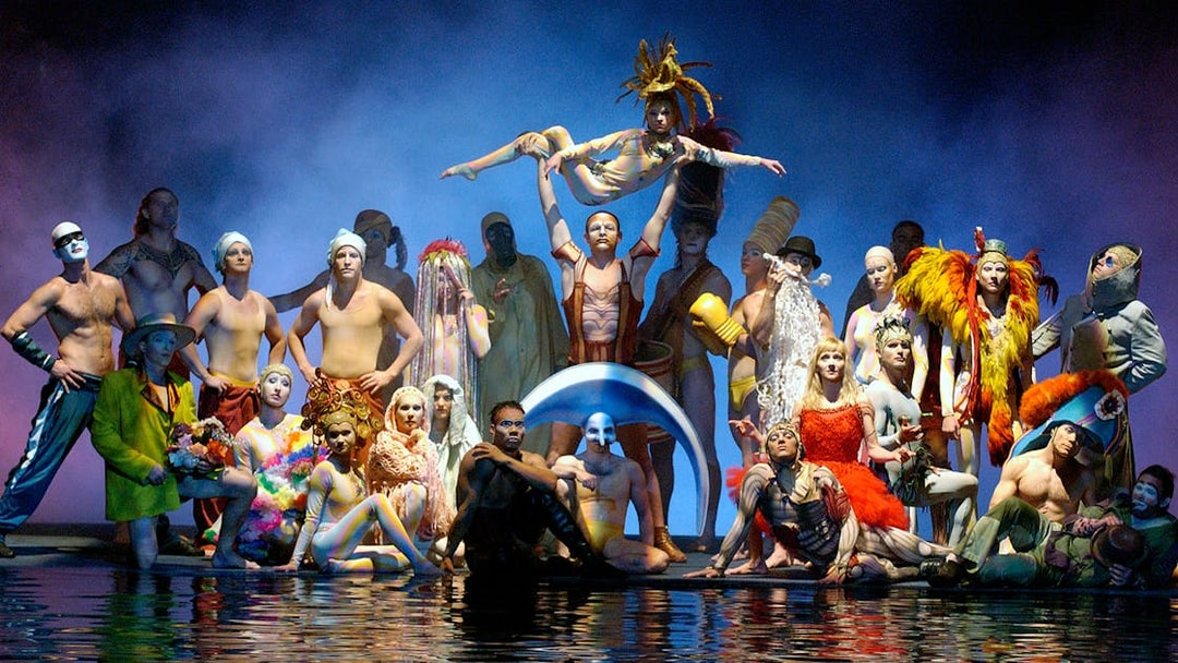 Performers in colorful costumes on stage at Cirque du Soleil's "O" show in Las Vegas.