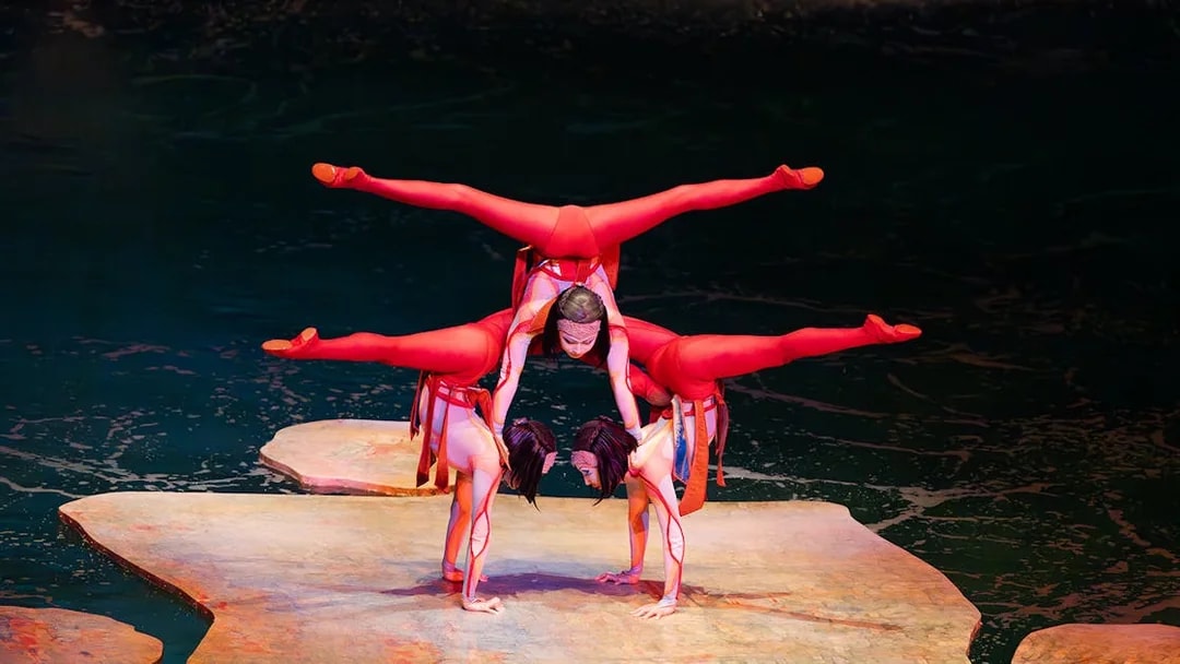Acrobats performing a balancing act on stage at the O show in Las Vegas.