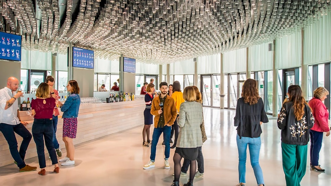 Visitors enjoying wine tasting at Cite du Vin's Belvedere in Bordeaux.