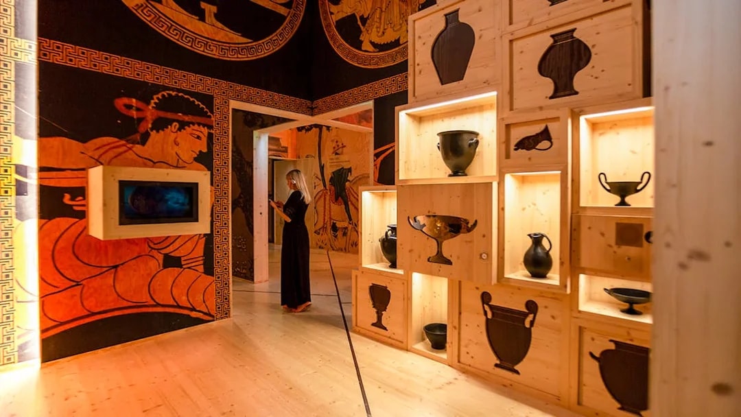 Visitors exploring wine exhibits at Cité du Vin museum in Bordeaux, France.