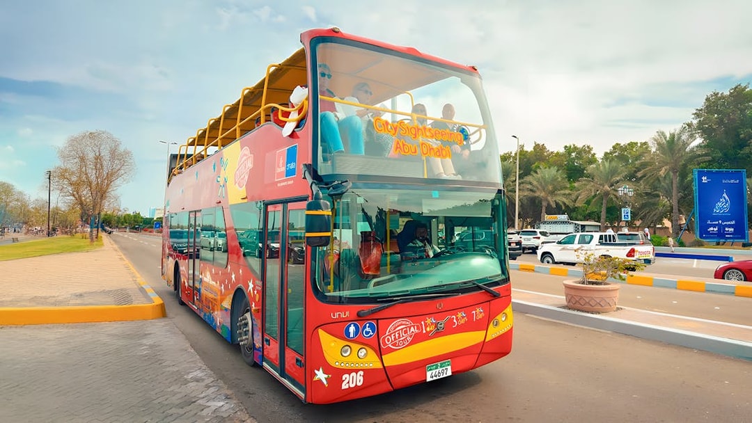 Open-top double-decker bus on Abu Dhabi City Sightseeing tour.