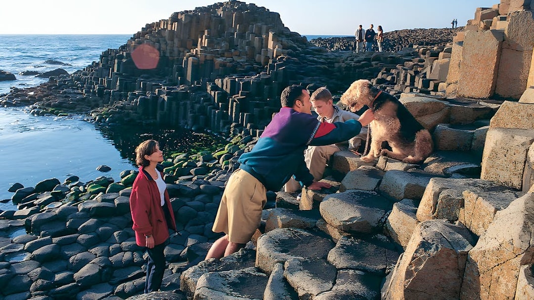 Visitors exploring Giant’s Causeway rock formations in Belfast.