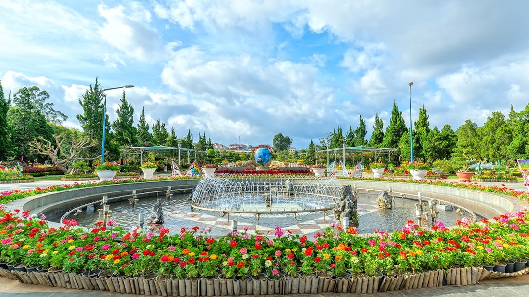 Panoramic view of a flower garden with a fountain in Dalat, Vietnam.