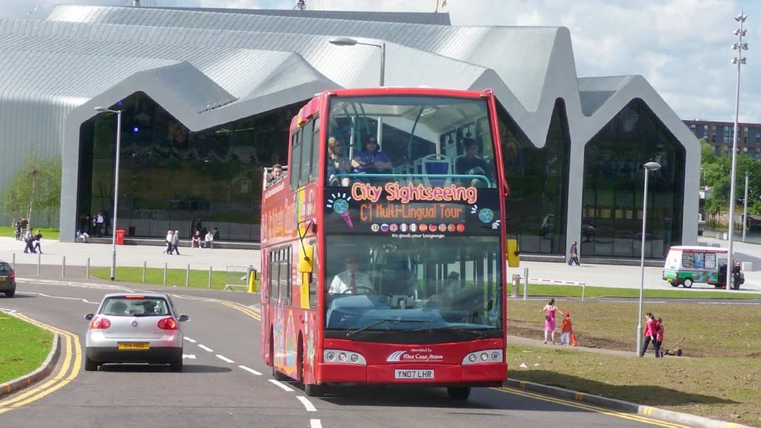 Citysightseeing tour bus in front of Riverside Museum, Glasgow.