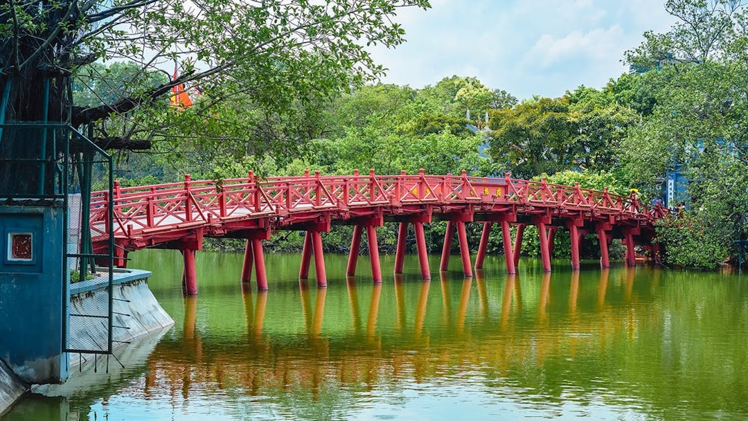 Red bridge over Hoan Kiem Lake in Hanoi, part of Hop-on Hop-Off Sightseeing Tours.