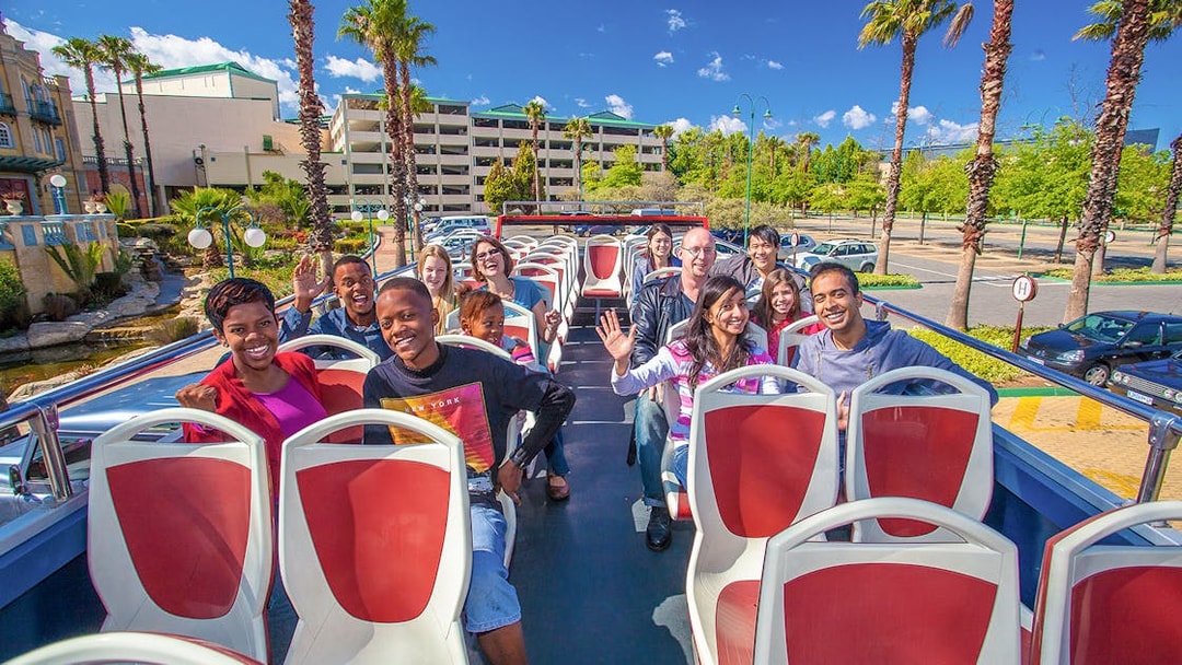 Passengers enjoying a hop-on hop-off bus tour in Johannesburg.