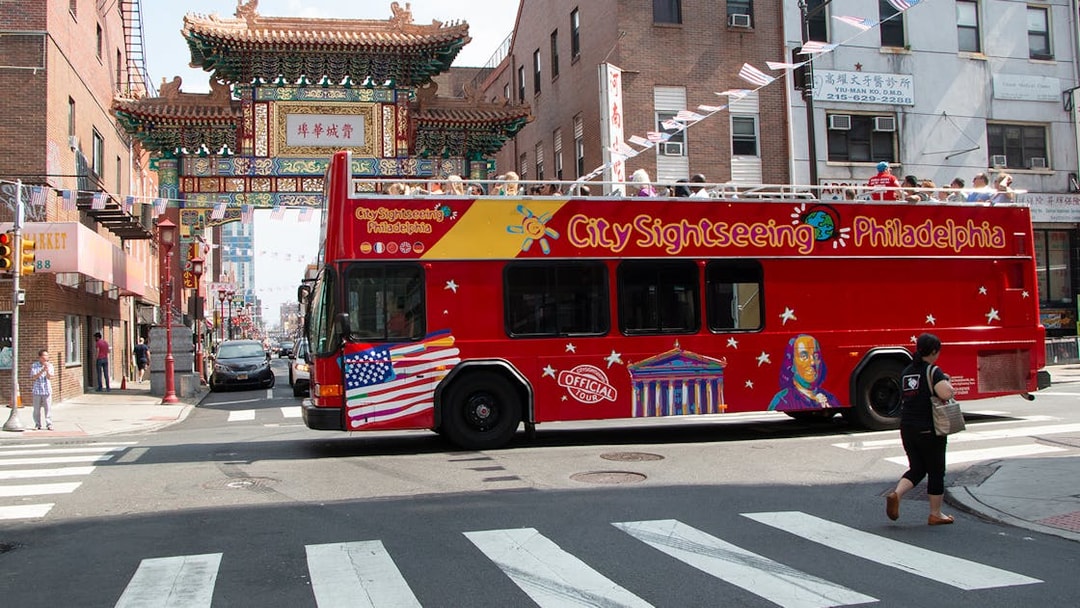 Philadelphia sightseeing bus near Chinatown Friendship Gate on Hop-On-Hop-Off Tour.