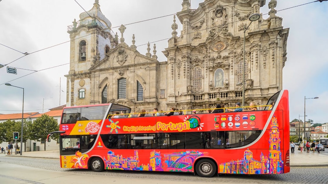 HOHO tour bus in front of Igreja do Carmo, Porto, Portugal.