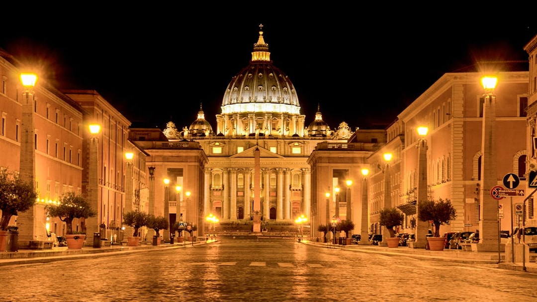 St. Peter's Basilica illuminated at night during a Rome night tour.