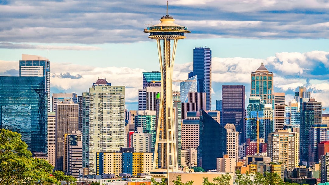 Space Needle with Seattle skyline on Hop-On Hop-Off Bus tour.