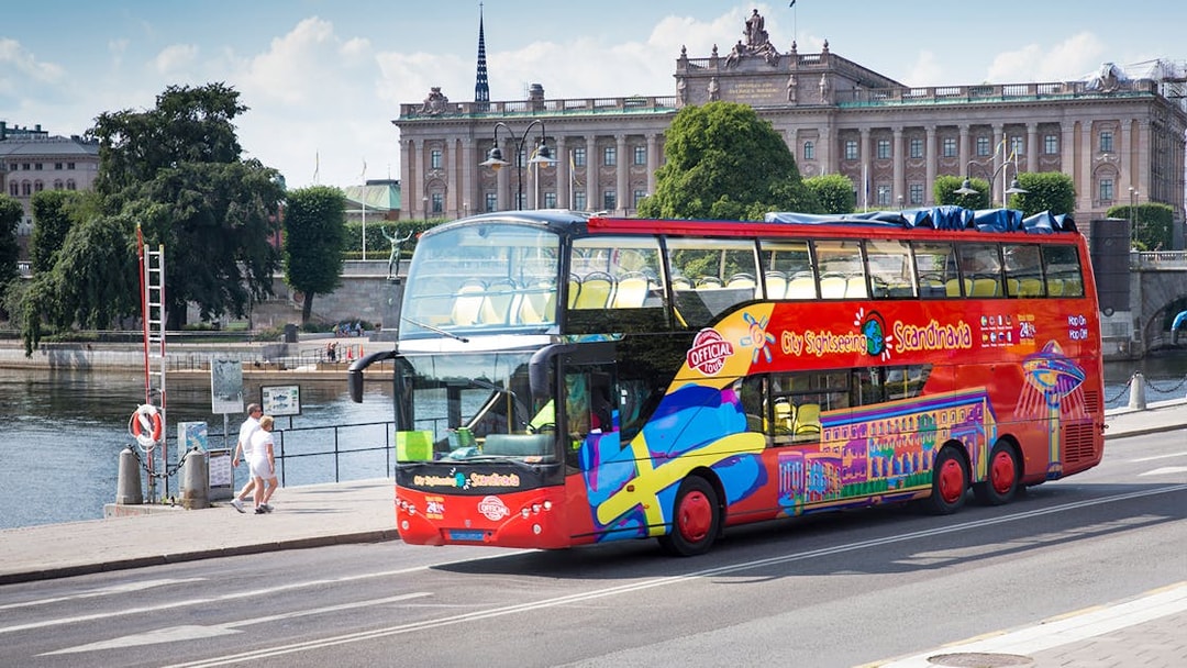 Open-top tour bus in Stockholm near the Royal Palace.