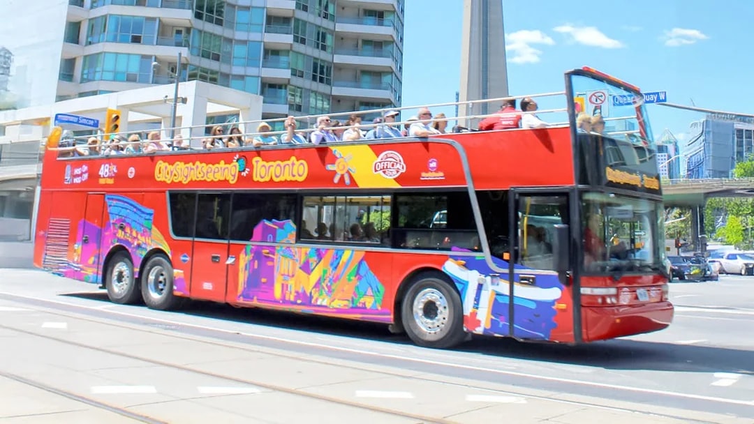 City Sightseeing bus in downtown Toronto near CN Tower.
