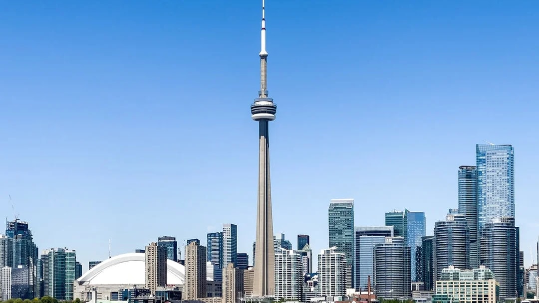 Toronto skyline featuring the CN Tower and surrounding buildings.