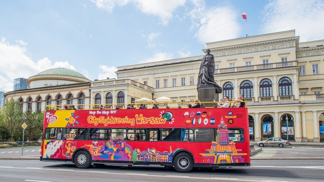 City sightseeing bus in front of the Palace of Minister of Treasure, Warsaw.