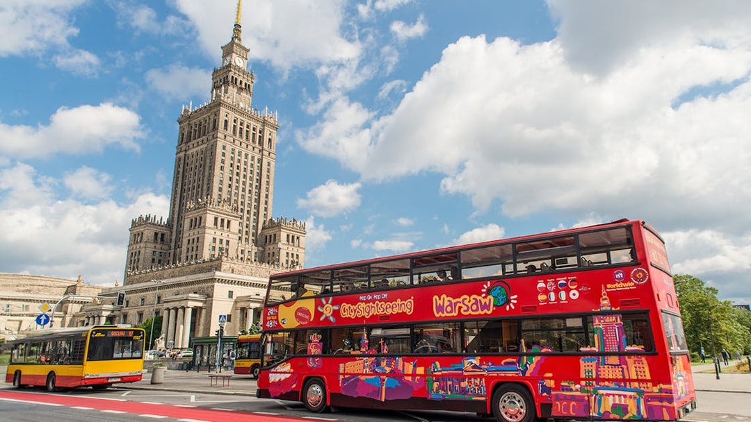 Warsaw hop-on hop-off bus near Palace of Culture and Science.