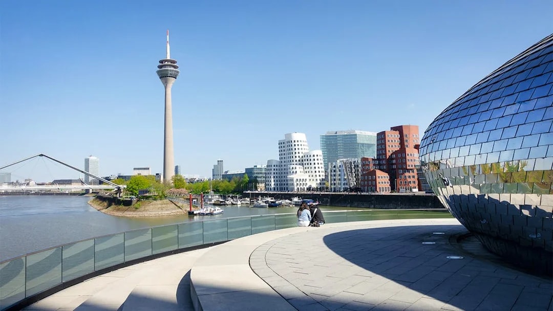 Medienhafen Dusseldorf with Rheinturm and modern architecture on city tour.