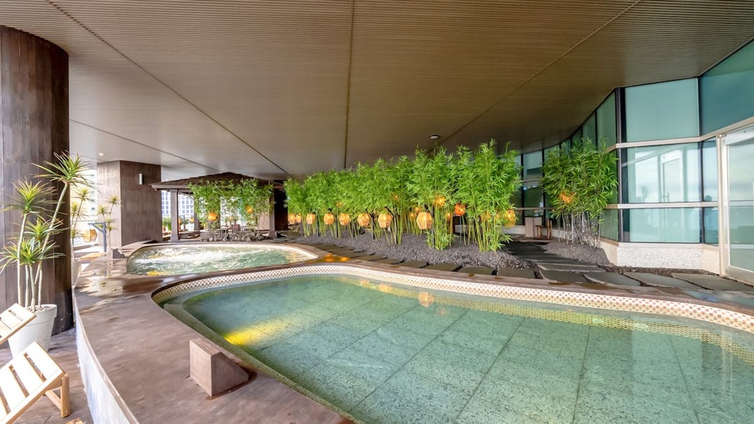 Indoor jjimjilbang spa pools with bamboo decorations at Club D Oasis.