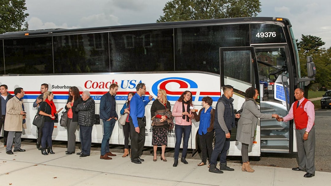 Passengers boarding Coach USA bus from Chicago O'Hare to Milwaukee.